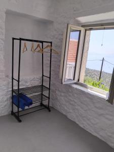 a room with a bunk bed in a room with a window at Oniropagida Nisyros apartments #2 Nikia view in Nikiá