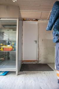 an open door of a refrigerator in a kitchen at Studio Apartment / 20min From City Center / Tórshavn in Tórshavn