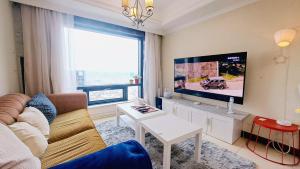 Μια τηλεόραση ή/και κέντρο ψυχαγωγίας στο Niwill Homestay +35 φωτογραφίες