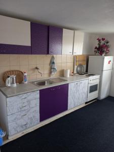 a kitchen with a sink and a refrigerator at Guest House Visoko in Visoko