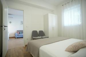 Ένα ή περισσότερα κρεβάτια σε δωμάτιο στο Apartments Petrich