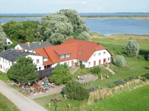 an aerial view of a house with a group of people at Hotel Enddorn Hiddensee in Kloster