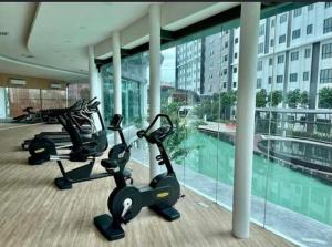 a gym with two exercise bikes in a building at M Centura Sentul in Kuala Lumpur