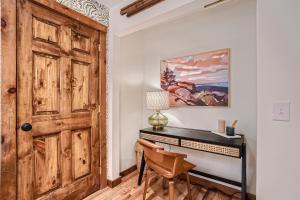 an office with a wooden door and a desk at Trollhagen 5 Condo in Breckenridge