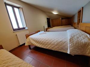 Casa per Ferie Ulivo d'Assisi客房内的一张或多张床位