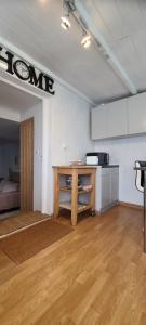 a room with a kitchen with a table in it at EMA Cottage in Montjean