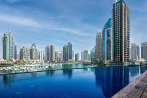 a view of a city with tall buildings at Luxury Iconic Cayan Tower - Free 5 star Beach Resorts Access! in Dubai