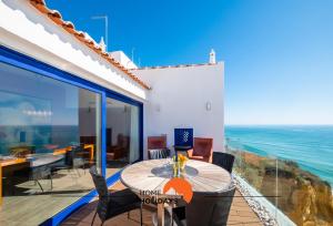 a house with a view of the ocean at #041 Private Beach View, High Speed WiFi, 20 mts Beach in Albufeira