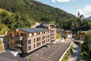 an aerial view of a building in the mountains at AlpenParks Wildbach Lodge Hochkönig in Dienten am Hochkönig
