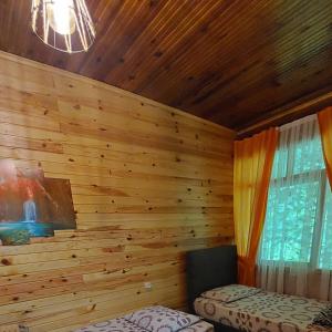 A bed or beds in a room at AYDER Nazlı çiçek apart