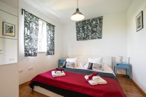 Postel nebo postele na pokoji v ubytování Apartments Karisima