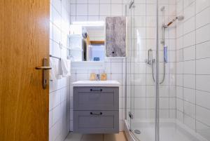 a bathroom with a sink and a shower at Apartments Karisima in Korčula