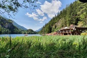 a view of a lake and a resort at Apart Christoph in Oetz