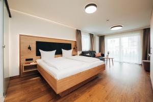 Rúm í herbergi á Hotel Tradizio