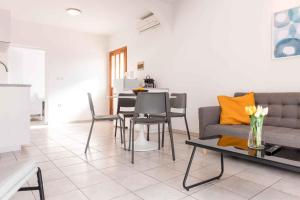 a living room with a couch and a table at Apartment in Silo with Two-Bedrooms 1 in Šilo
