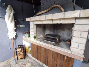 a brick oven with a grill inside of it at Apartment in Silo with Two-Bedrooms 1 in Šilo