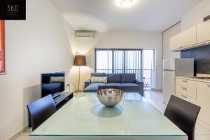 A seating area at Modern & private 1BR APT in the Heart of Paceville by 360 Estates