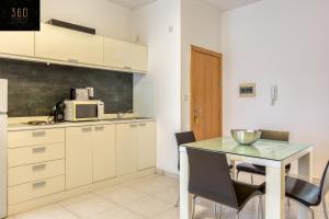 A kitchen or kitchenette at Modern & private 1BR APT in the Heart of Paceville by 360 Estates