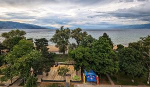 an aerial view of a park next to the water at Vila Vadeha in Pogradec