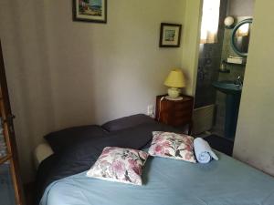 מיטה או מיטות בחדר ב-Chez Eliane