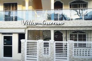 a building with a sign that reads wildlife crimes at Villa Gumio Studio Apt - 7 minutes walk to Boca Chica Beach apts in Boca Chica