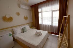 Postel nebo postele na pokoji v ubytování ŞEREF APART MOTEL