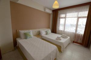 Postel nebo postele na pokoji v ubytování ŞEREF APART MOTEL