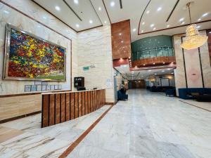 a lobby of a hospital with a painting on the wall at Nada Al Majd Hotel in Mecca