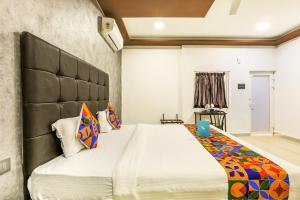 a bedroom with a large bed in a room at FabHotel Prime Sea Shore Resort in Calangute