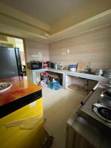 a kitchen with a counter and a sink in it at Your Home Away B&B in Sylhet