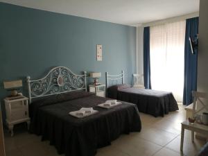 Posteľ alebo postele v izbe v ubytovaní Villa Oasi