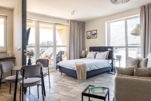 Posteľ alebo postele v izbe v ubytovaní apartamenty-wroc Old Town Residence
