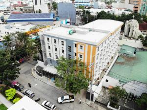 an overhead view of a building in a city at The City Flats Sacred Heart in Manila