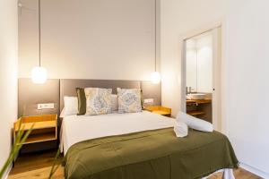 Ένα ή περισσότερα κρεβάτια σε δωμάτιο στο Puerto Beach suites
