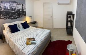 a bedroom with a large bed with a picture on the wall at CasaBella Chioggia in Chioggia