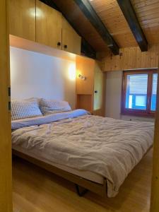 Ένα ή περισσότερα κρεβάτια σε δωμάτιο στο Apartment Alps View -Mont Rouge Veysonnaz