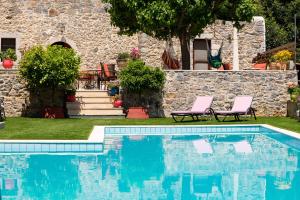 The swimming pool at or close to Metohi Nature Living