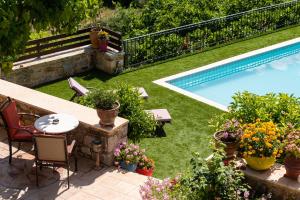 The swimming pool at or close to Metohi Nature Living