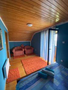 a living room with a couch and a table at Holiday Home Darko in Žabljak