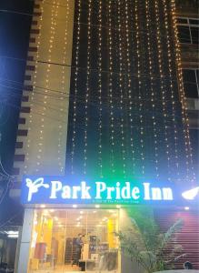 a park pride inn sign in front of a building at PARK PRIDE INN in Patna