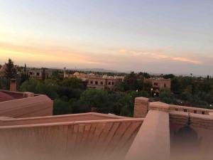 a view of a city from the roof of a building at Villa Jolyamelkis - golf Marrakech in Marrakech
