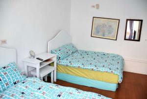 Postel nebo postele na pokoji v ubytování Caramel Macchiato Homestay
