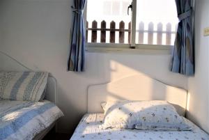 Postel nebo postele na pokoji v ubytování Caramel Macchiato Homestay