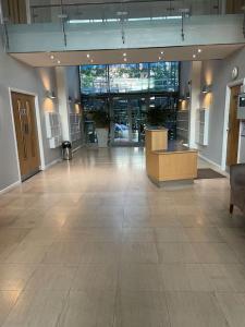 a large lobby with a large room with a large glass wall at 31 Galleria Court in London