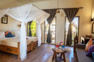 Voodi või voodid majutusasutuse Clove Island Villas & Spa toas