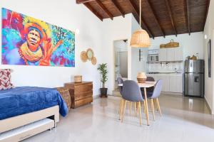 a bedroom with a bed and a table and chairs at CASA HOTEL FIBA MAGUEZA in San Francisco