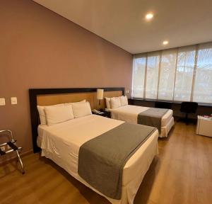 Postel nebo postele na pokoji v ubytování Mi Hotel Sandiego