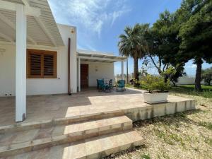 a porch of a house with a patio at Case vacanze Spagnola 106 in Marsala