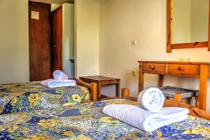 Postel nebo postele na pokoji v ubytování Hotel Benitses Arches