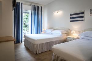 Voodi või voodid majutusasutuse Murè Hotel Numana toas